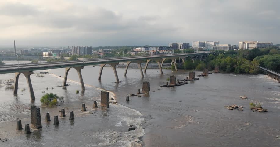 Aerial view of a bridge that crosses the sea and connects a metropolis