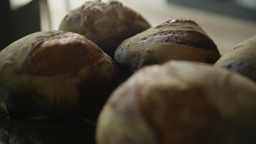 A row of bread is on the counter