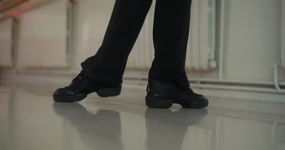 Close up of a womans legs doing ballet moves