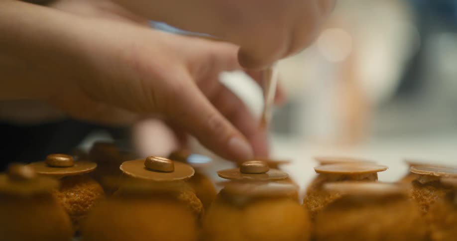 A close up clip of people decorating and painting