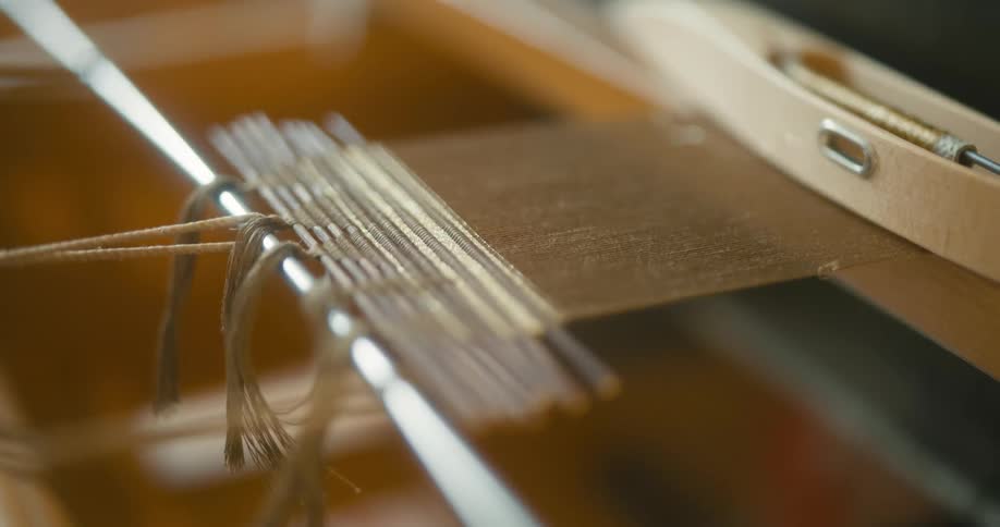 Close up of a small weaving loom