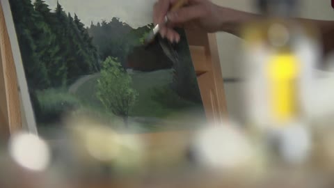 Painter painting a landscape