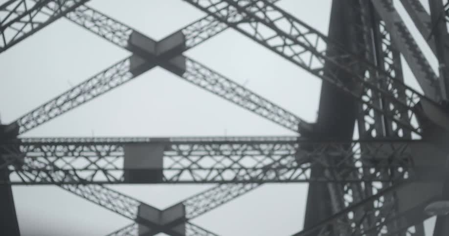 Crossing a bridge and looking up at all the supports