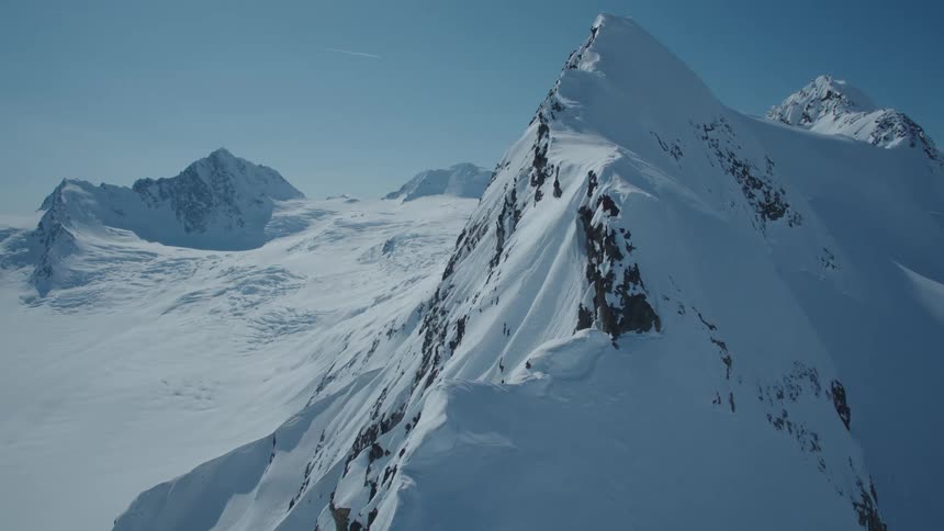 Aerial view of a mountain valley covered in snow