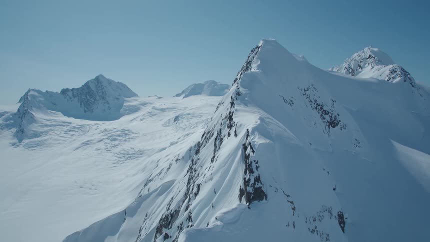 Aerial view of snow covered mountains in a valley