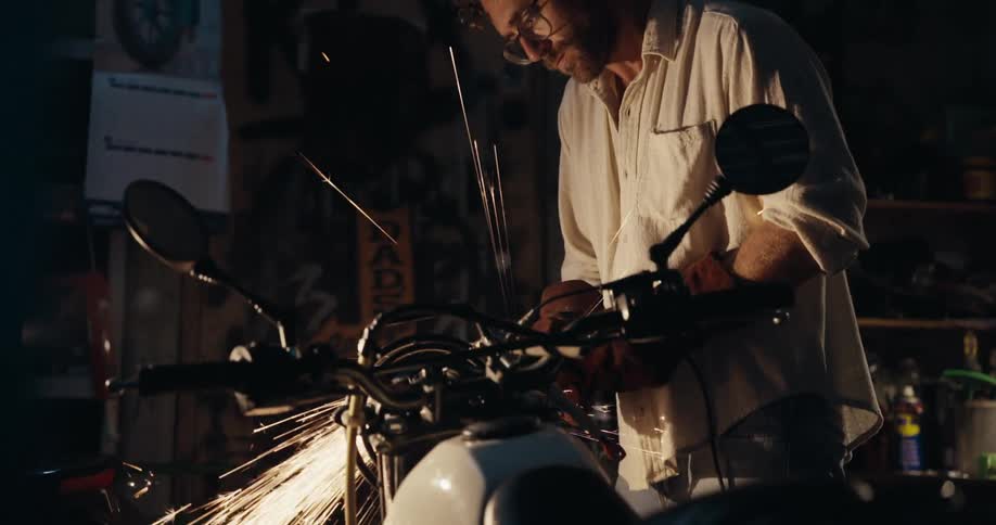 Mechanic working on a motorcycle in a workshop