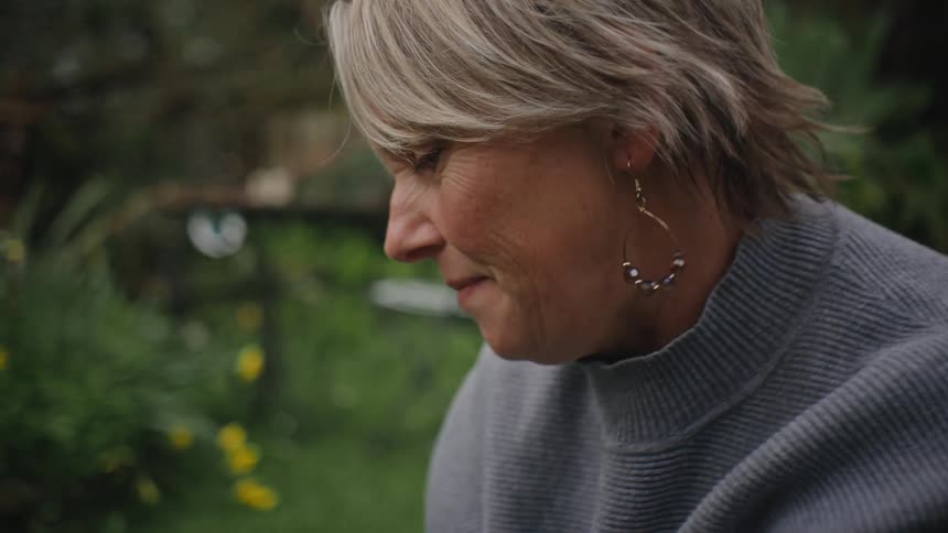 Portrait of a womans face in a garden