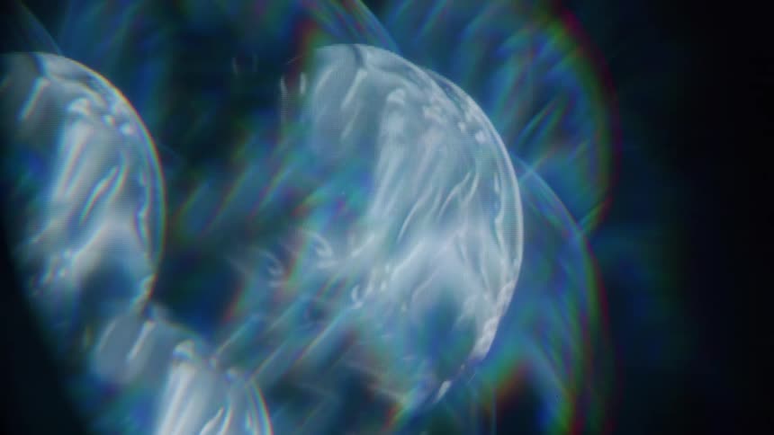 A collection of abstract iridescent shapes float against a dark background