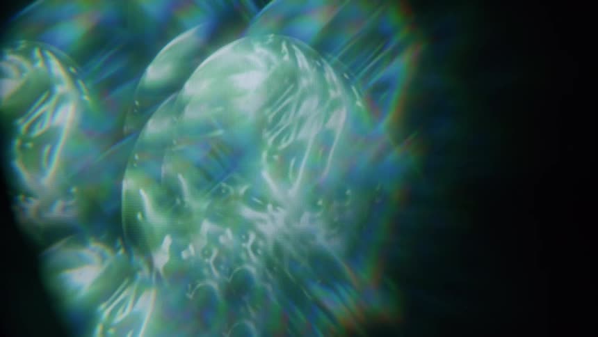 Closeup of a textured translucent surface with light refracting creating an abstract pattern of colors and shapes