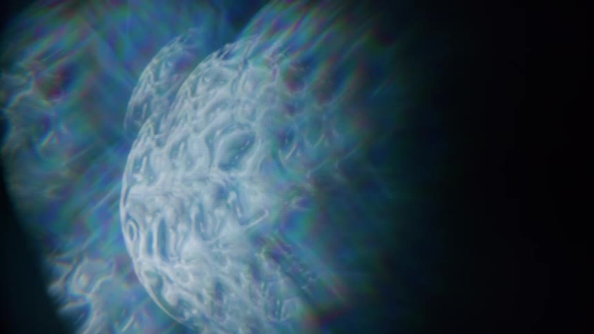A swirling luminescent orb cloaked in a mist of iridescent hues dominates the dark expanse emanating an otherworldly aura