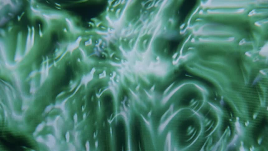 A swirling abstract pattern in shades of green and white