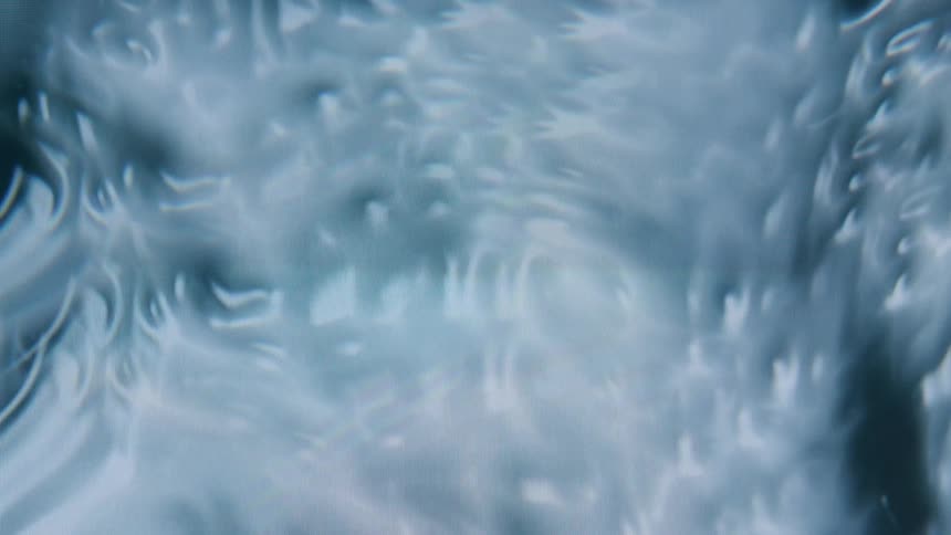 Swirling patterns of blue and white create an abstract marbled design