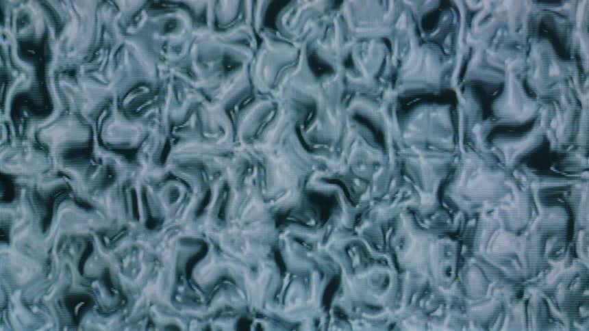 A close up clip of an abstract liquid organism