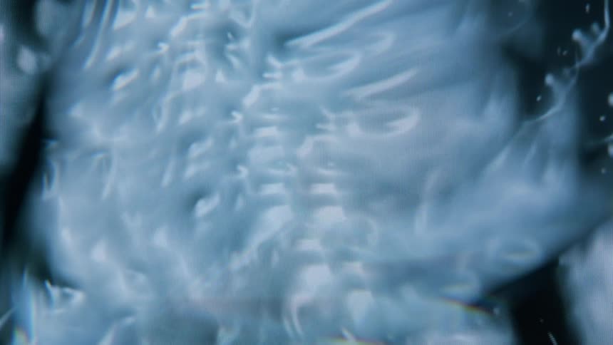 Swirling patterns of blue and white create an abstract marbled design