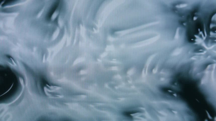 Swirling patterns of blue and white create an abstract marbled design