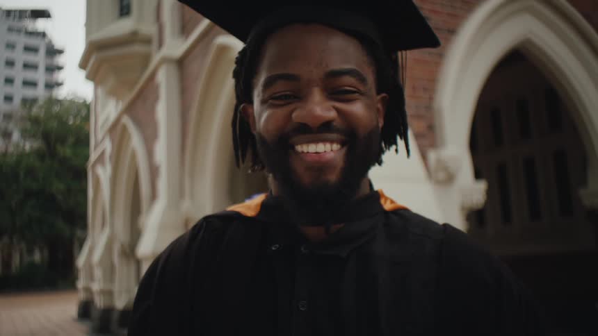 Portrait of a smiling man in gown