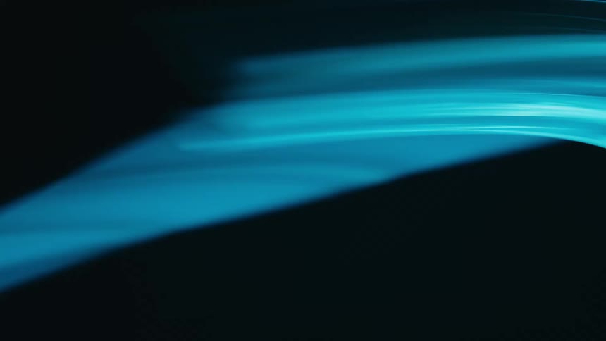 Two glowing blue lines spinning against a dark background