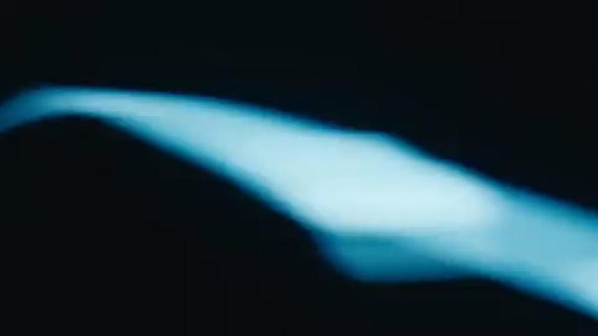 Blue light and abstract movement in a dark environment