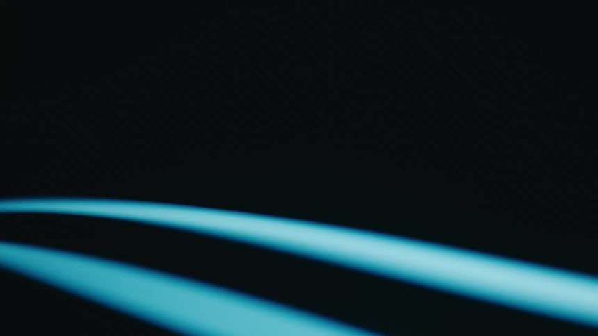 Two curved glowing blue lines spinning against a dark background