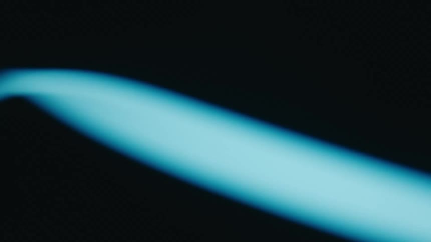 Blue lights moving in a circular motion in and out of the camera frame