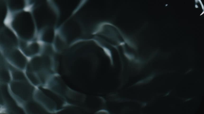 Close up of a clear liquid in rotating motion