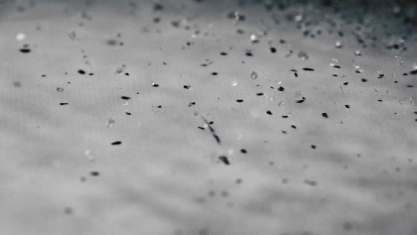 Sand and dirt bumped from underneath a solid surface