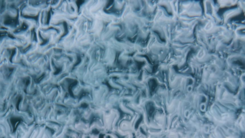 Dense and abstract liquid in white color in motion
