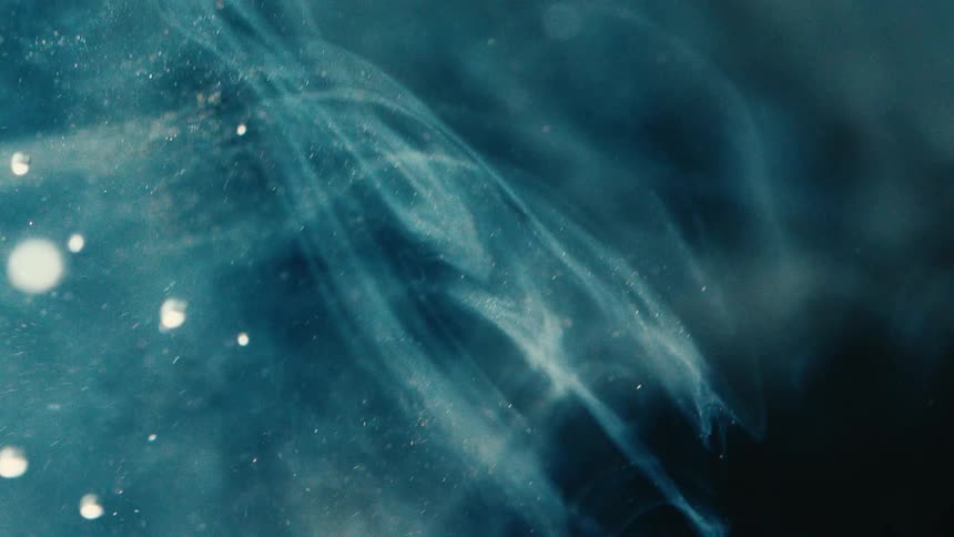 Extreme close up of a liquid with an abstract glow