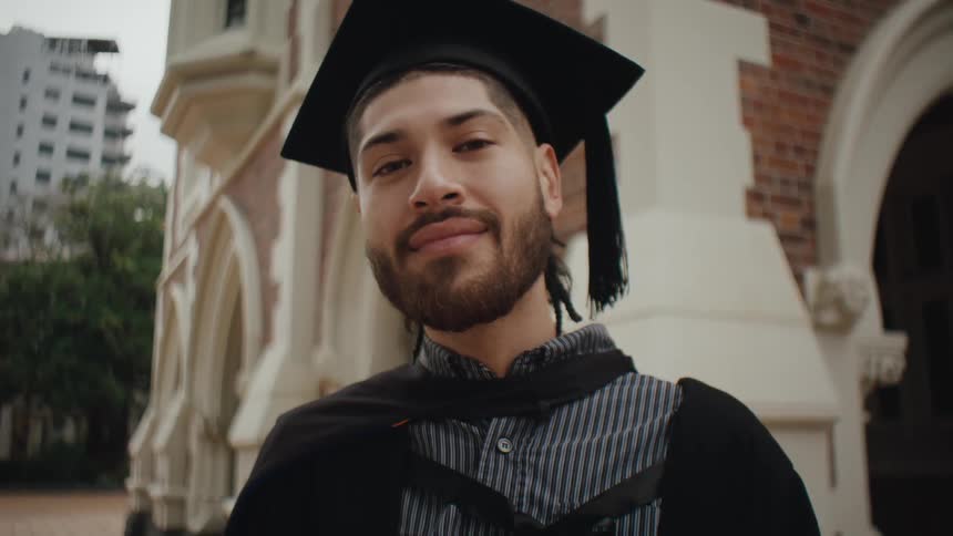 Portrait of a man in a graduation gown