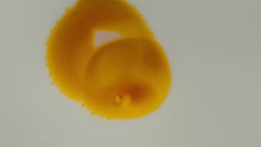 Extreme close up on an abstract orange droplet