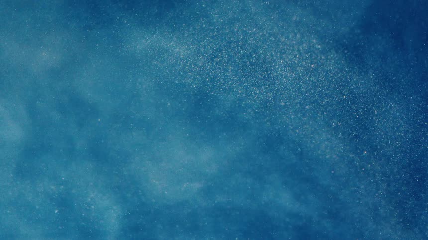 White sparkles float in a blue hue
