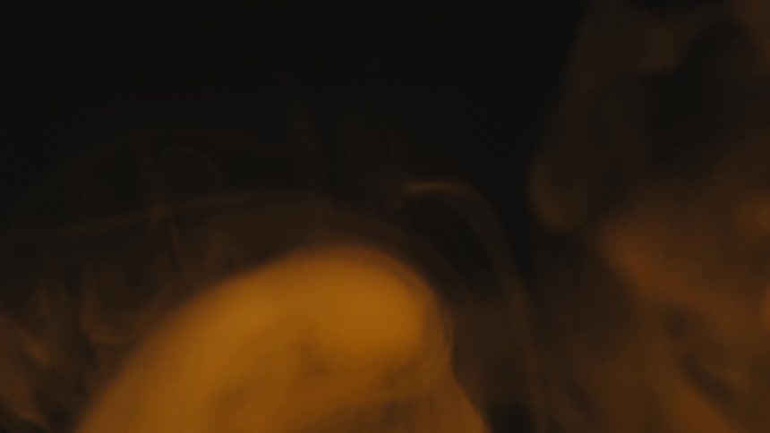 Moving smoke against a black background
