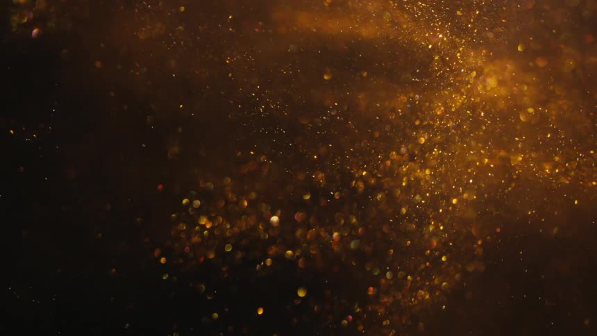 A clip of a floating gold dust