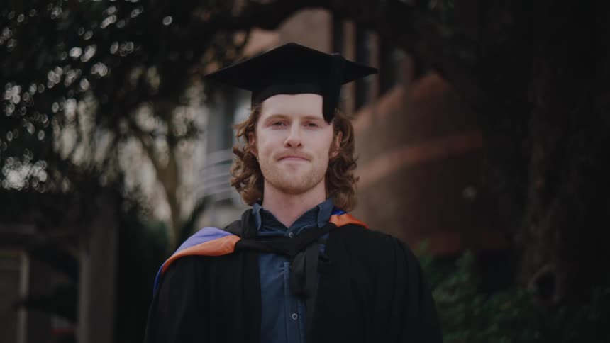 Young man in graduation gown
