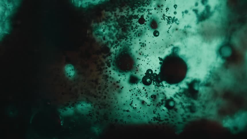 An abstract clip of floating dark bubbles