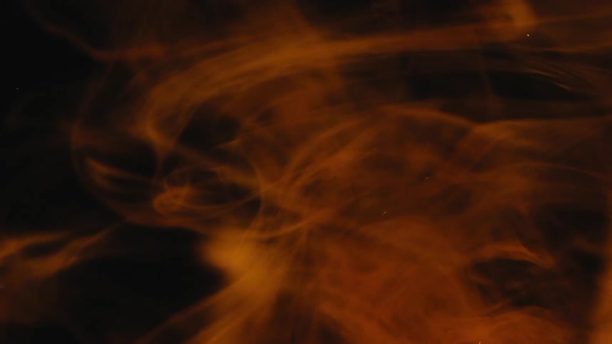 A swirling mass of brown smoke fills the frame