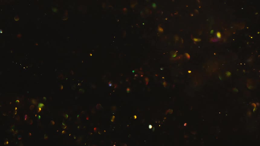 Liquid with shiny sequins in motion