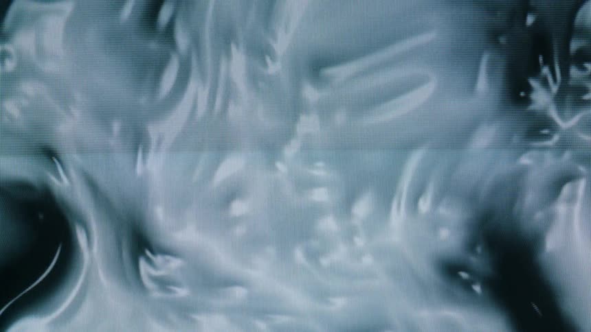 Abstract close up of thick white liquid swirling around