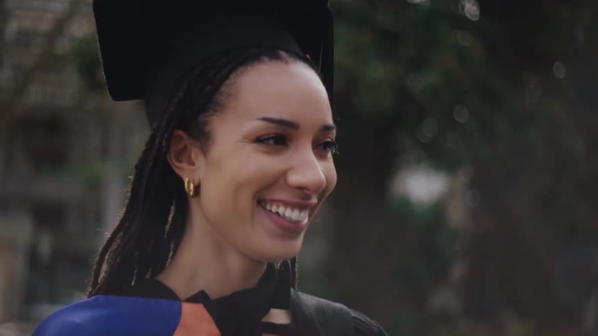 A close up clip of a graduating student having a conversation