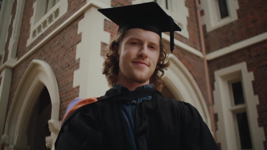 Portrait of a man in graduation gown