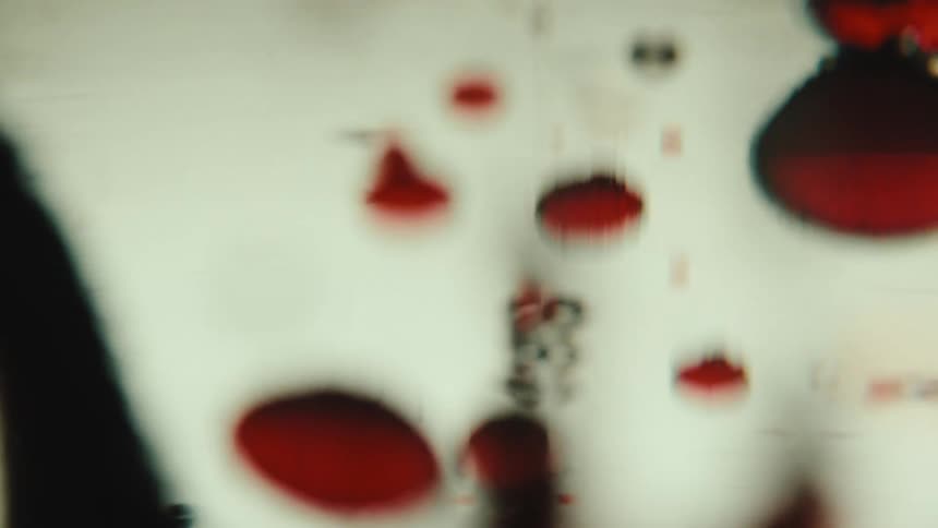 Abstract red droplets floating in a liquid