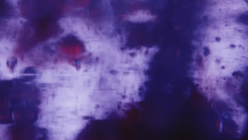Extreme close up of bubbles of different sizes in an abstract liquid