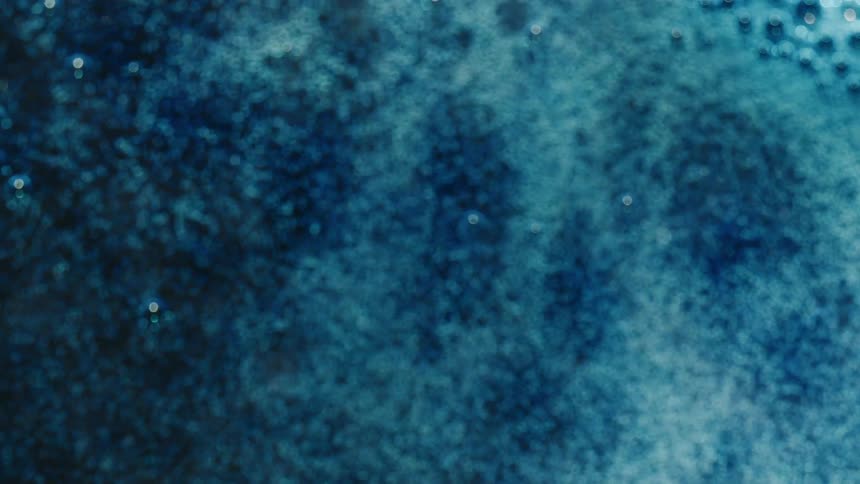 Bubbles popping in an abstract liquid