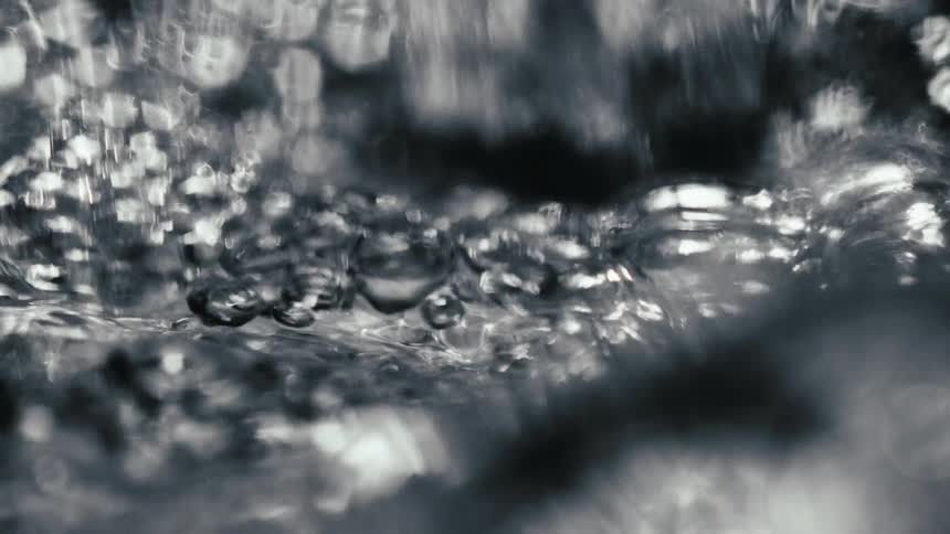 Water being poured brings up bubbles