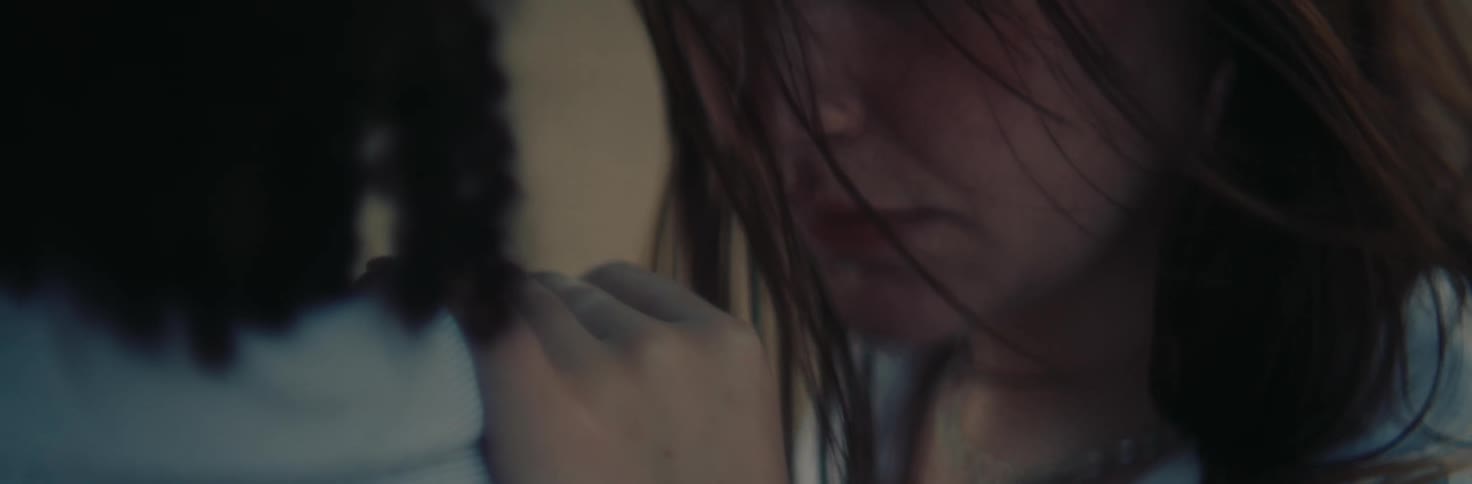Closeup of two women with their faces close to each other