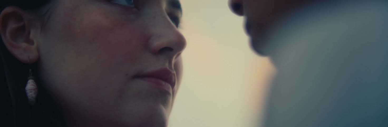 Closeup of two womens faces staring at each other