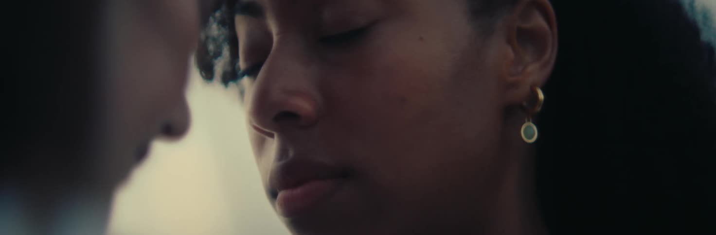 Two young women looking at each other face to face