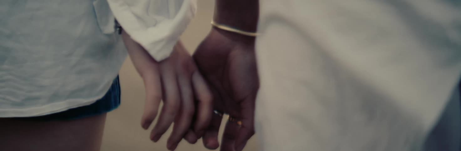A clip of people holding hands