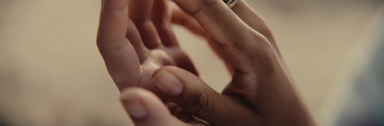 Two hands of two people together