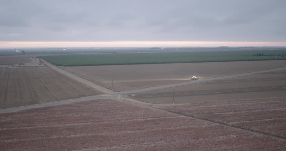 Aerial view of a large agricultural field on a cloudy day